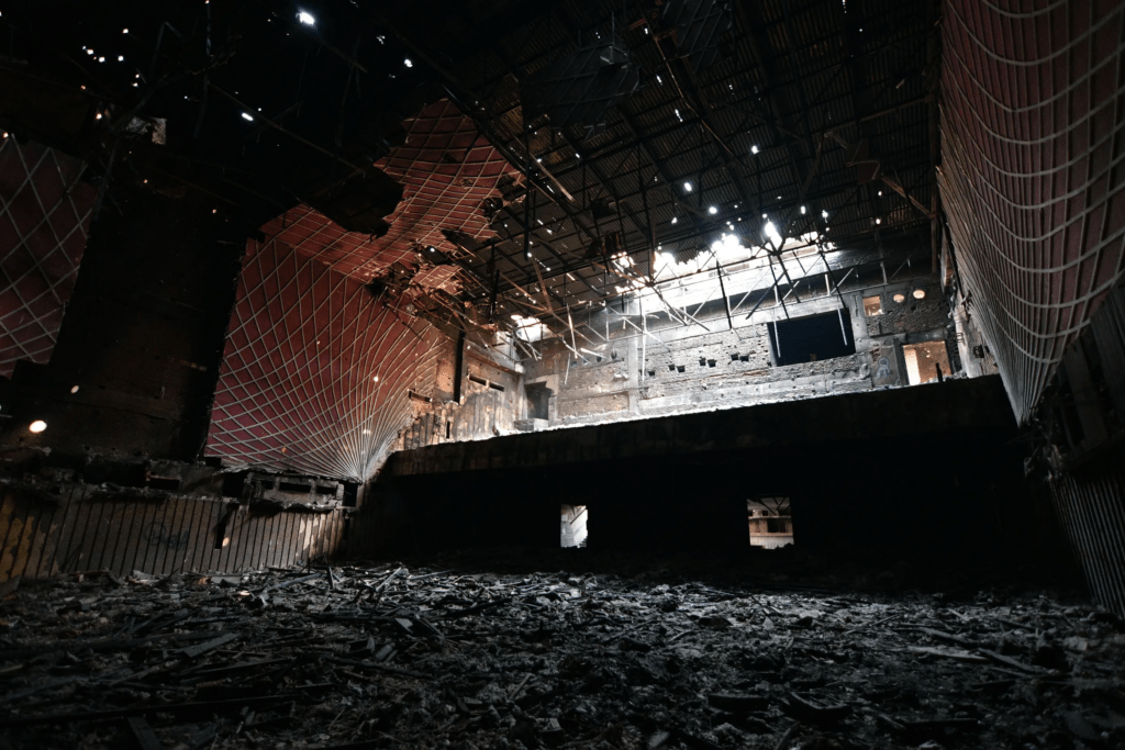 Dusty and burnt balcony seats in the abandoned Uphaar Cinema, where locked exits trapped victims during the deadly 1997 fire, fueling the families' resolve.