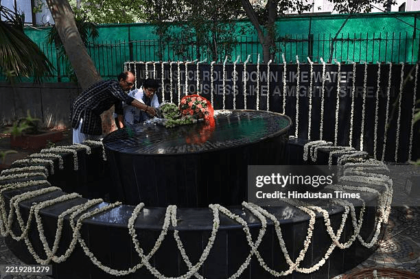 Family members paying tribute at a memorial for Uphaar Cinema fire victims in Delhi, a lasting symbol of remembrance and Neelam Krishnamoorthy's persistent fight against forgetting.