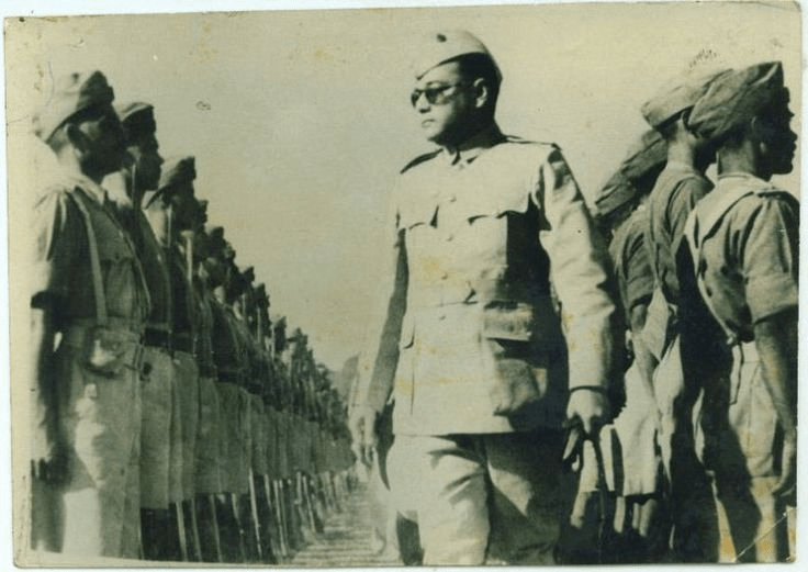 Netaji Subhas Chandra Bose reviewing troops of the Azad Hind Fauj, the leader whose life Neera Arya saved by stabbing her husband to prevent his assassination.