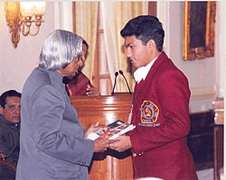 The President of India presenting a National Bravery Award to a brave child, recognizing exceptional courage in dangerous situations under the national bravery awards system.