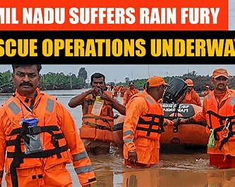 People and rescue workers navigating heavy rain and flood‑affected streets in southern India illustrating rising rain risks.