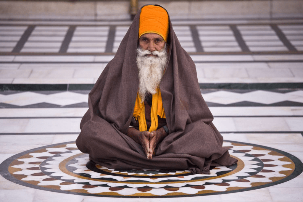 Sikh devotee in early morning meditation during Amrit Vela, practicing Naam Simran to prepare the soul for daily spiritual flight.