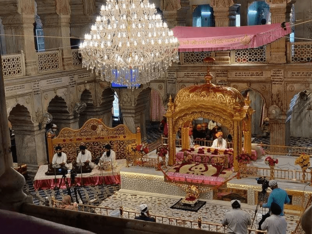 Interior of a Gurdwara with Guru Granth Sahib as the central focus, serving as the spiritual hangar for realignment and preparation before daily life.